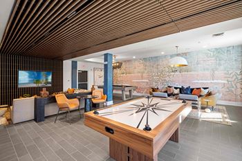 Game room with billiards and air hockey table